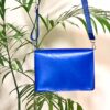 شنطة كروس جلد طبيعي أزرق ملكي بتصميم زاوية مثلث – Handmade by AMY Royal Blue Genuine Leather Crossbody Bag – Triangle Front Design | AMY