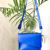 شنطة كروس جلد طبيعي أزرق ملكي بتصميم زاوية مثلث – Handmade by AMY Royal Blue Genuine Leather Crossbody Bag – Triangle Front Design | AMY