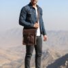 شنطة كروس, جلد بقري, صناعة يدوية, جيب أمامي, قفل إبزيم, شنطة رجالي, حقيبة صغيرة, تصميم عصري, استخدام يومي, سفر, متانة وفخامة, بني داكن Handmade dark brown men’s crossbody bag in cowhide leather with front pocket and buckle closure